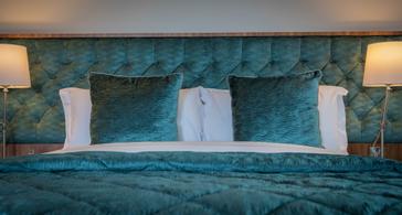 Grand Canal Hotel | Dublin 4 | Teal coloured pillows and blanket at the Grand Canal Hotel