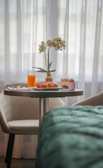 Grand Canal Hotel | Dublin 4 | Breakfast tray with orange juice, pastries and a boiled egg