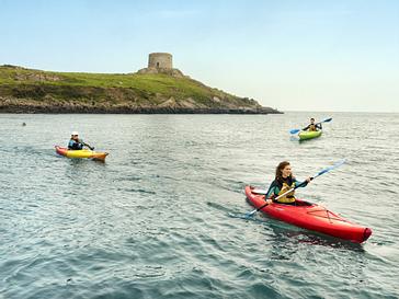Grand Canal Hotel | Dublin 4 | Three people kayaking at Dalkey islands